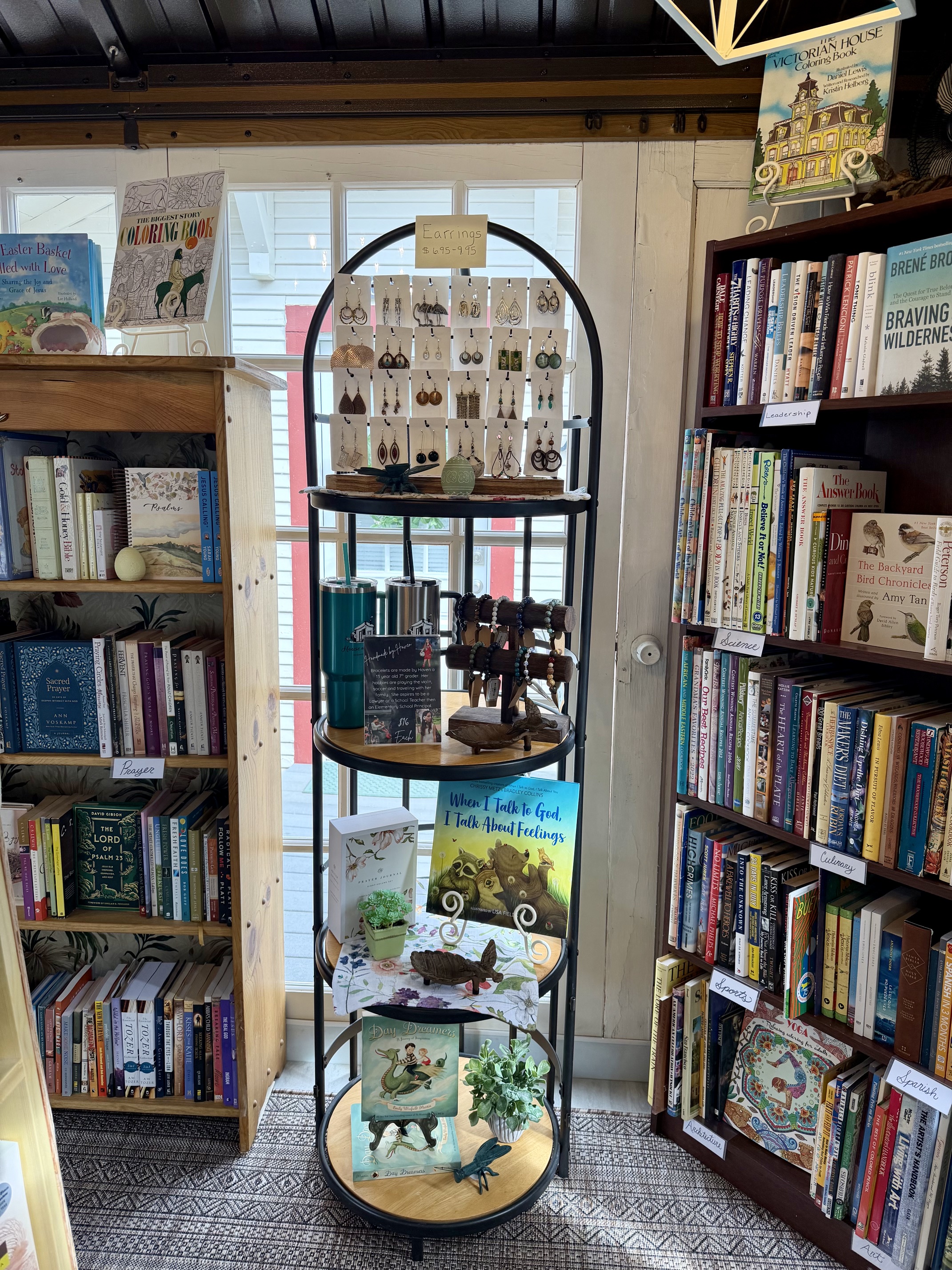 A round display of gifts, jewelry, and books inside House of the Book